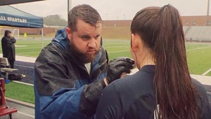 Chris helping a player