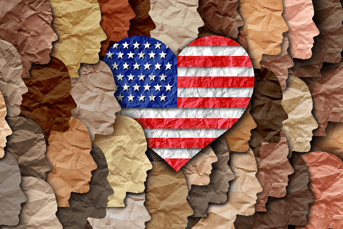 artwork with profiles of a diverse mix of faces with a heart shaped american flag in the center