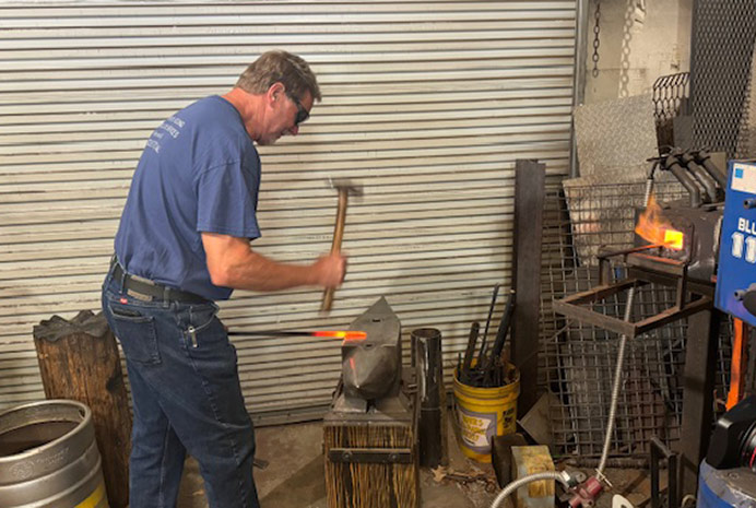 Patient Carl at his welding job