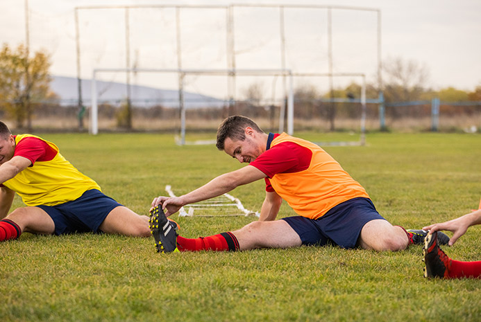 A soccer team stretches