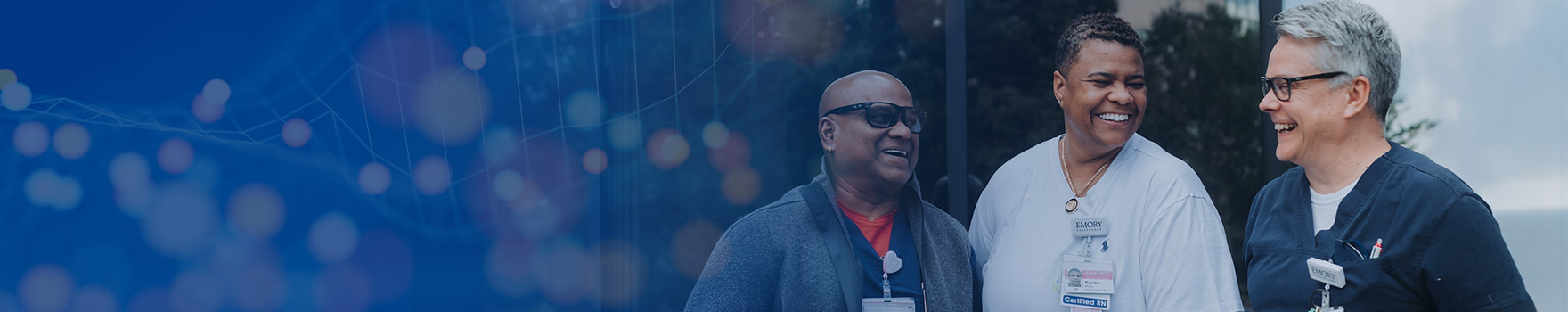 emory employees smiling and chatting outside