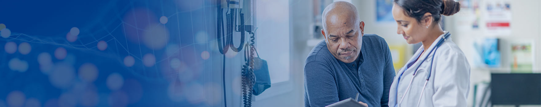 man looking at female doctor's report