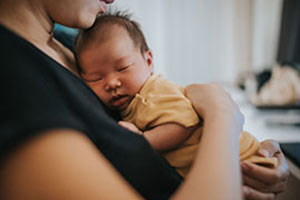 newborn baby with mother