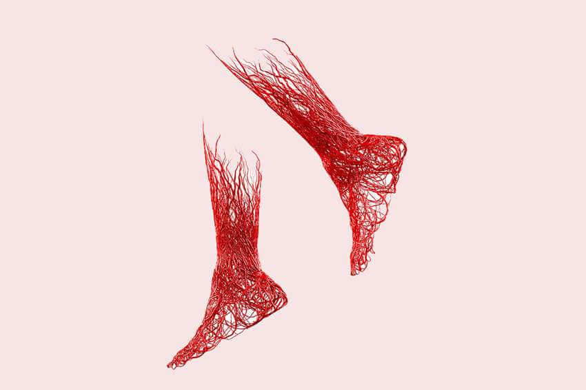 Red veins in the shape of a pair of legs with a plain pink background