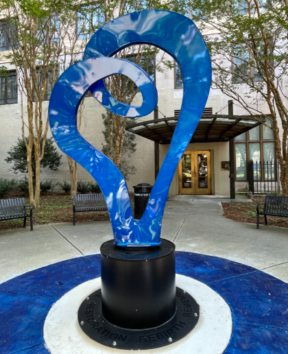A blue, heart-shaped sculpture