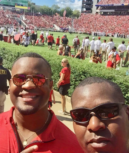 Roberts and his brother Tyrone at a football game