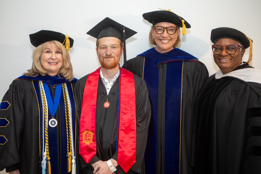 Grant poses with CSU officials