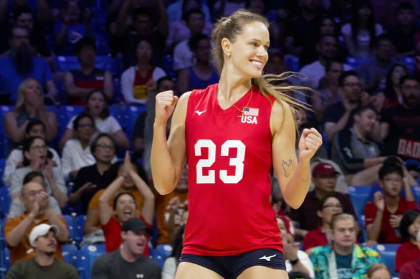 Kelsey Robinson Cook celebrates in front of a cheering crowd