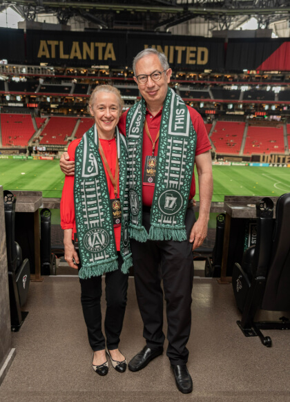 Jeannette Guarner and Carlos del Rio at an Atlanta United game