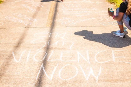 sidewalk chalk messages saying end gun violence now