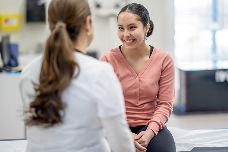 Patient listening to eye specialist in a clinical consultation room