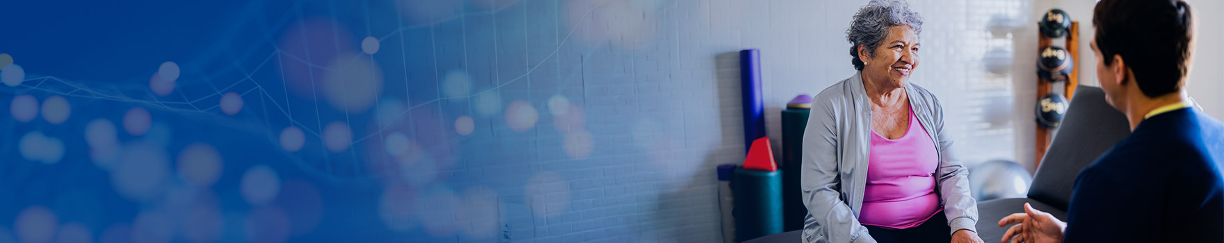 woman at rehab talking to her physical therapist