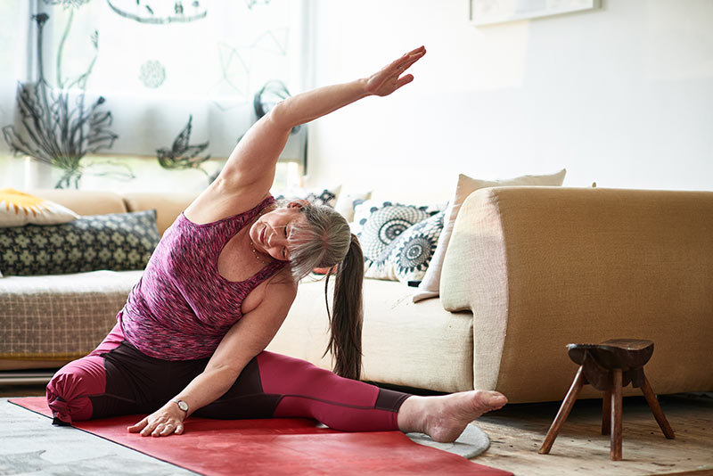 woman stretching at home
