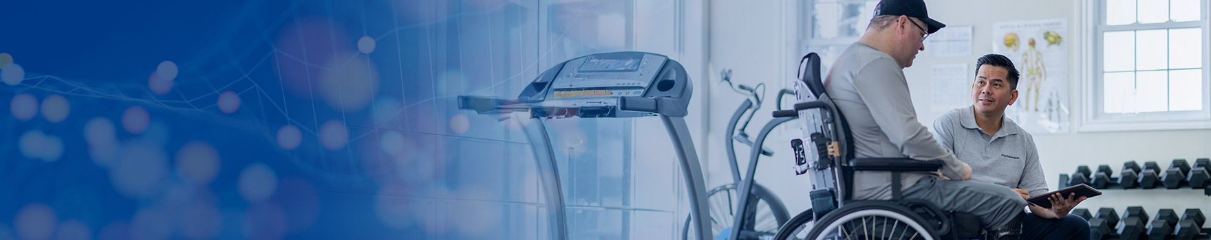 man in wheelchair speaking with a doctor