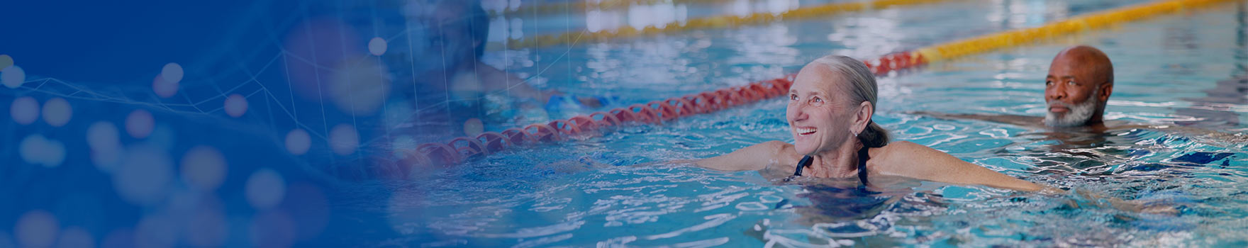 elderly man and woman stretching in the pool