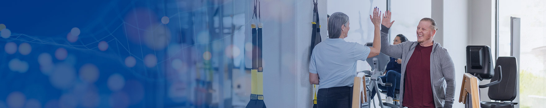 man at rehab high fiving nurse