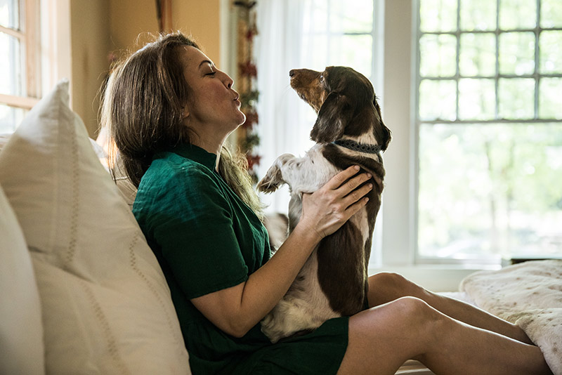woman with dog in her lap