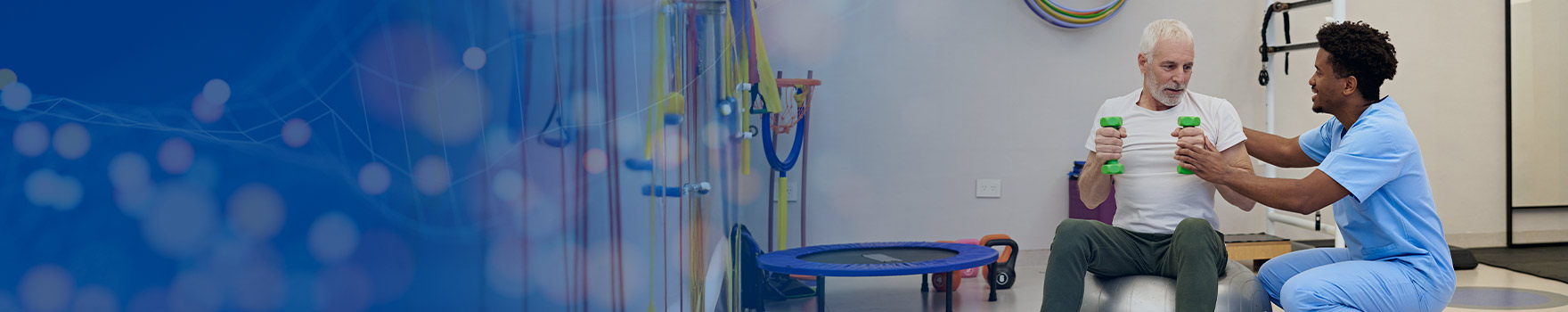elderly man working with weights with nurse's help